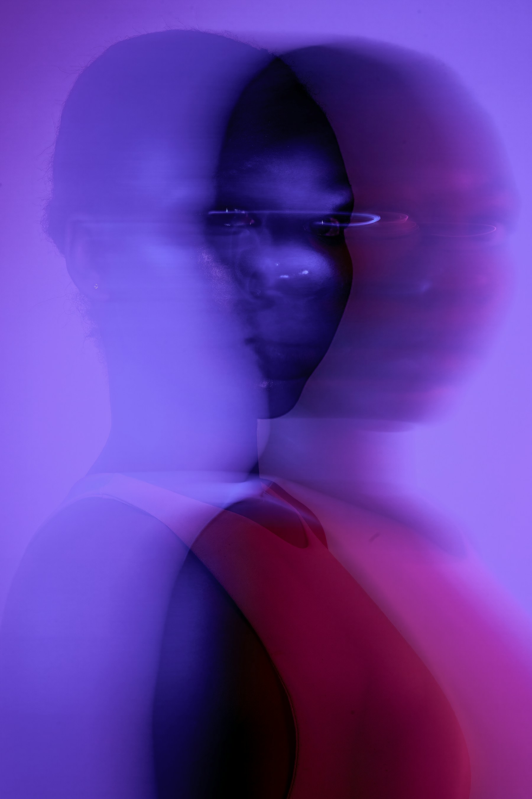 Purple double-exposure editorial portrait